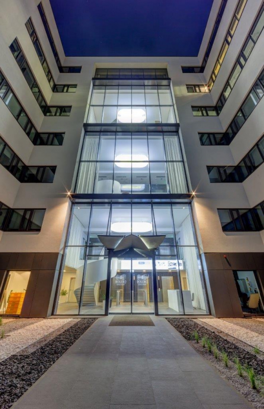 View of the illuminated main entrance to the building