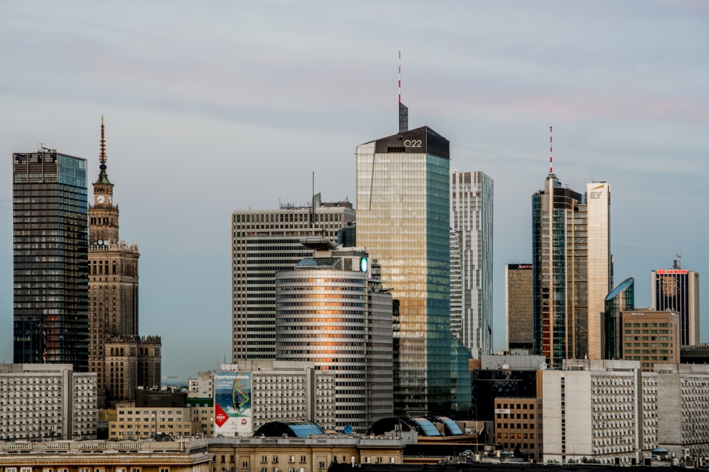 Q22 office building among buildings in Warsaw city center